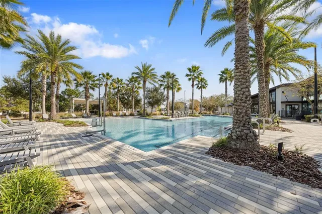 a view of swimming pool with a patio