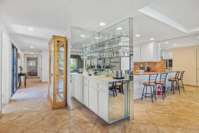 a view of kitchen with counter top dining table and stainless steel appliances