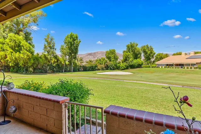 a view of a yard with an outdoor seating