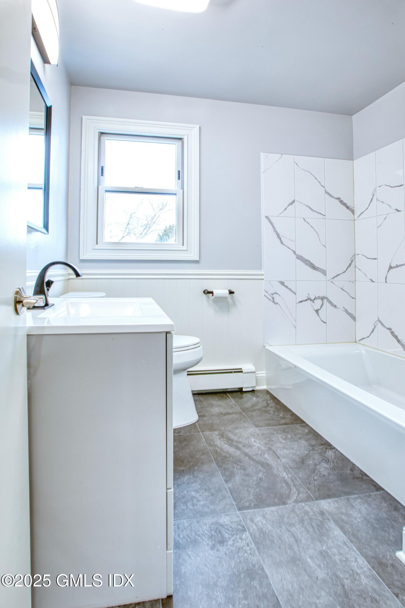 9 Apache Place Riverside, CT 06878 - Photo 15 of 23 a bathroom with a bathtub and a sink