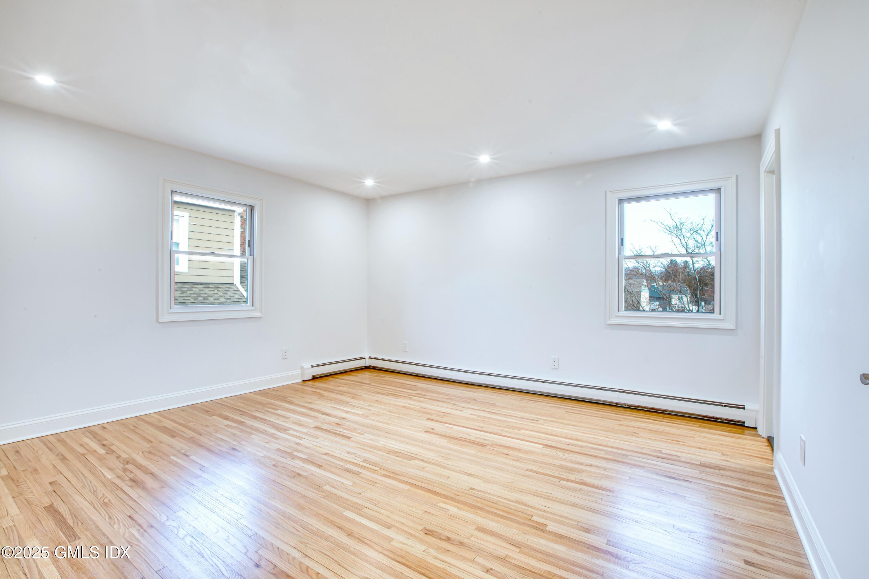9 Apache Place Riverside, CT 06878 - Photo 16 of 23 a view of empty room with wooden floor and fan