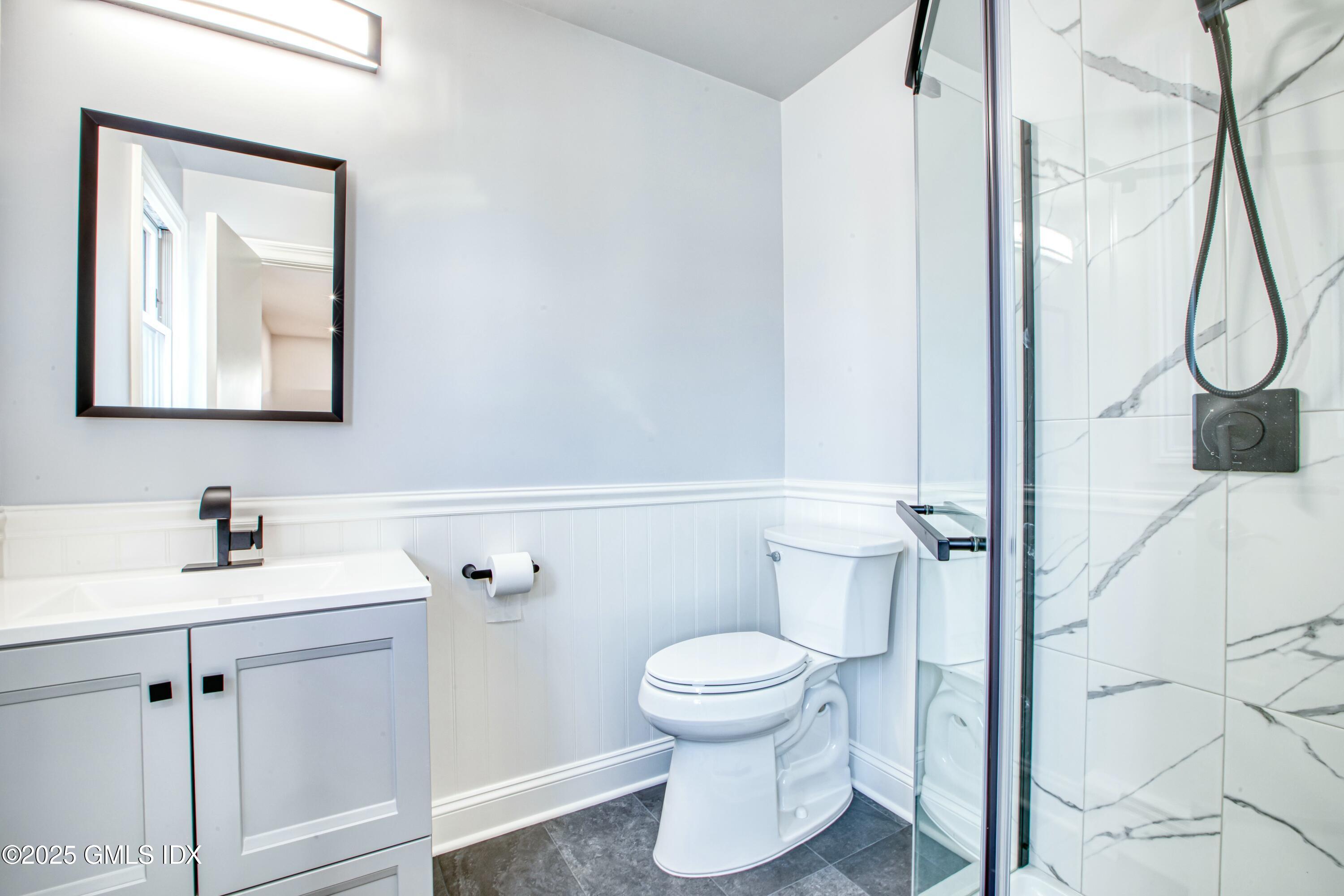 9 Apache Place Riverside, CT 06878 - Photo 18 of 23 a bathroom with a toilet sink and mirror