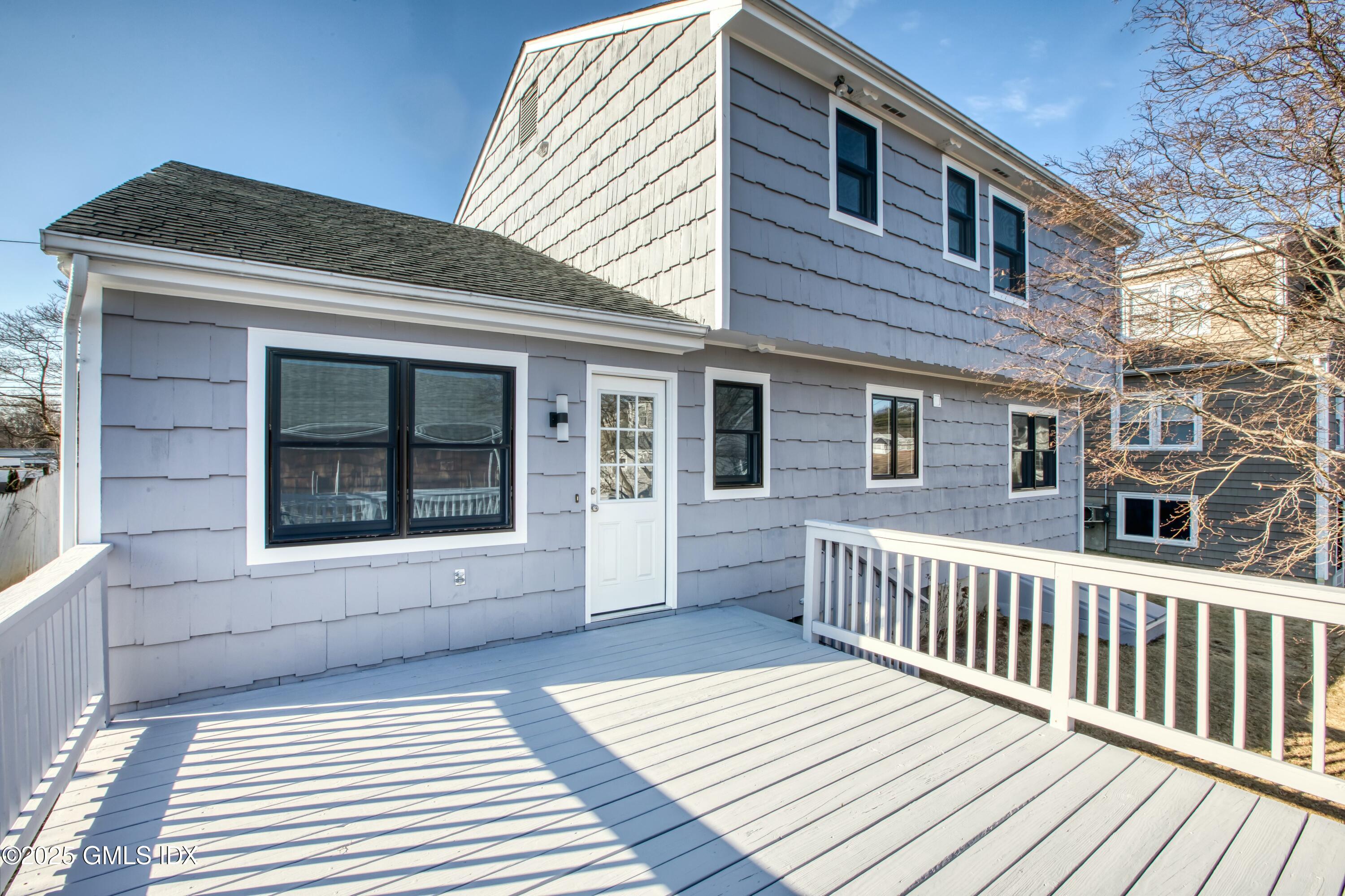 9 Apache Place Riverside, CT 06878 - Photo 2 of 23 a view of a house with a deck