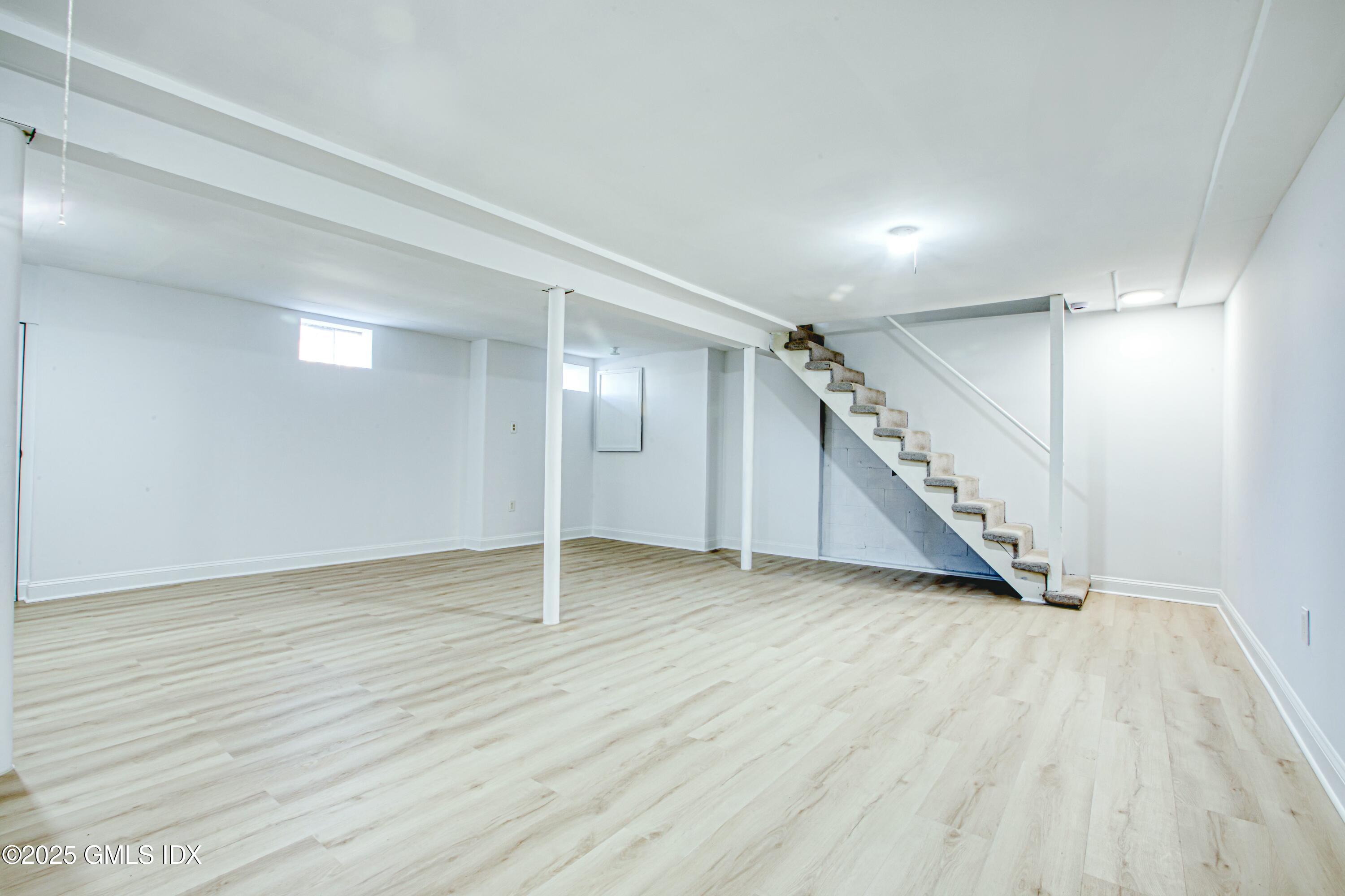 9 Apache Place Riverside, CT 06878 - Photo 22 of 23 a view of an empty room with wooden floor