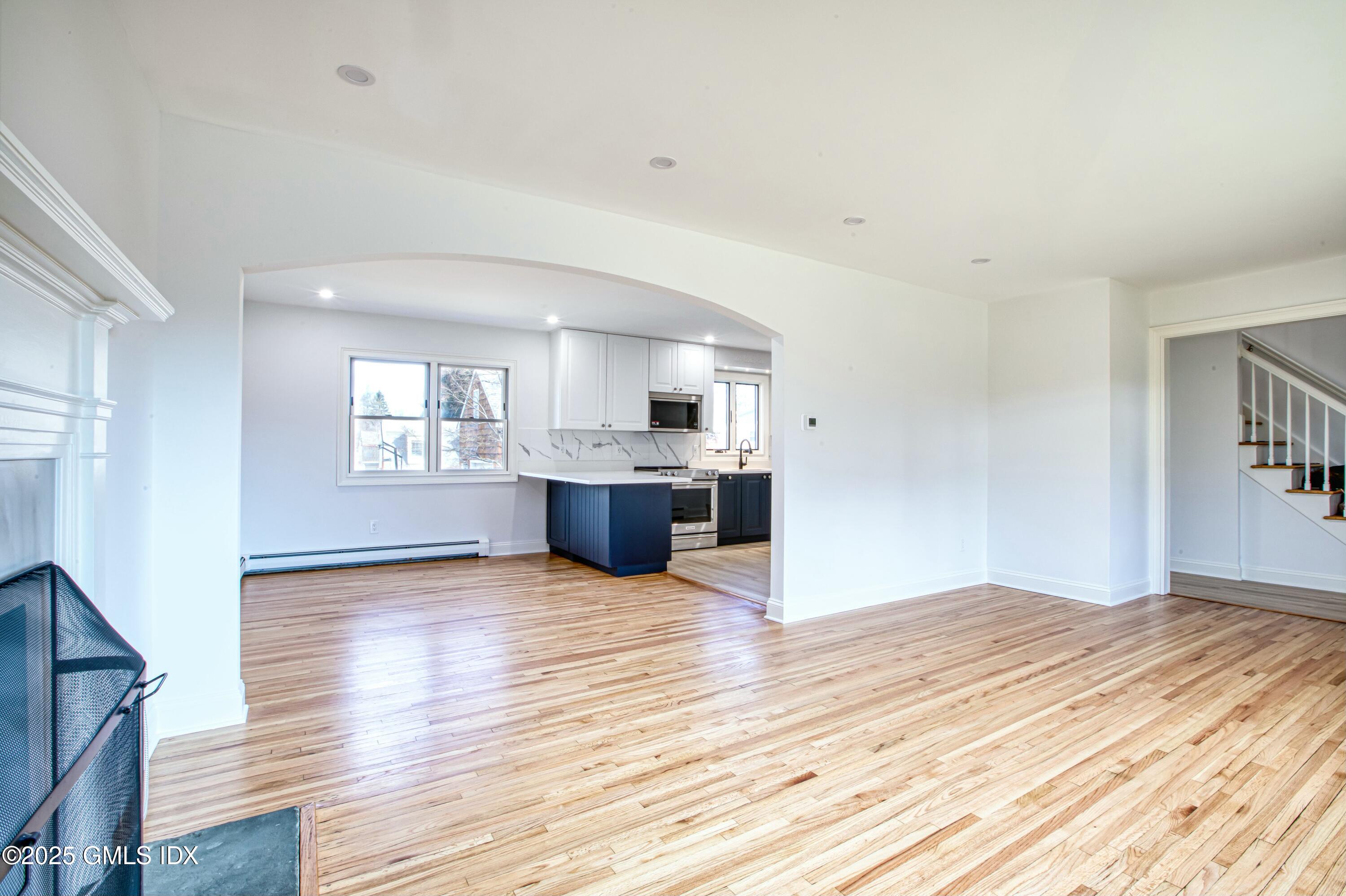 9 Apache Place Riverside, CT 06878 - Photo 5 of 23 an empty room with wooden floor and windows