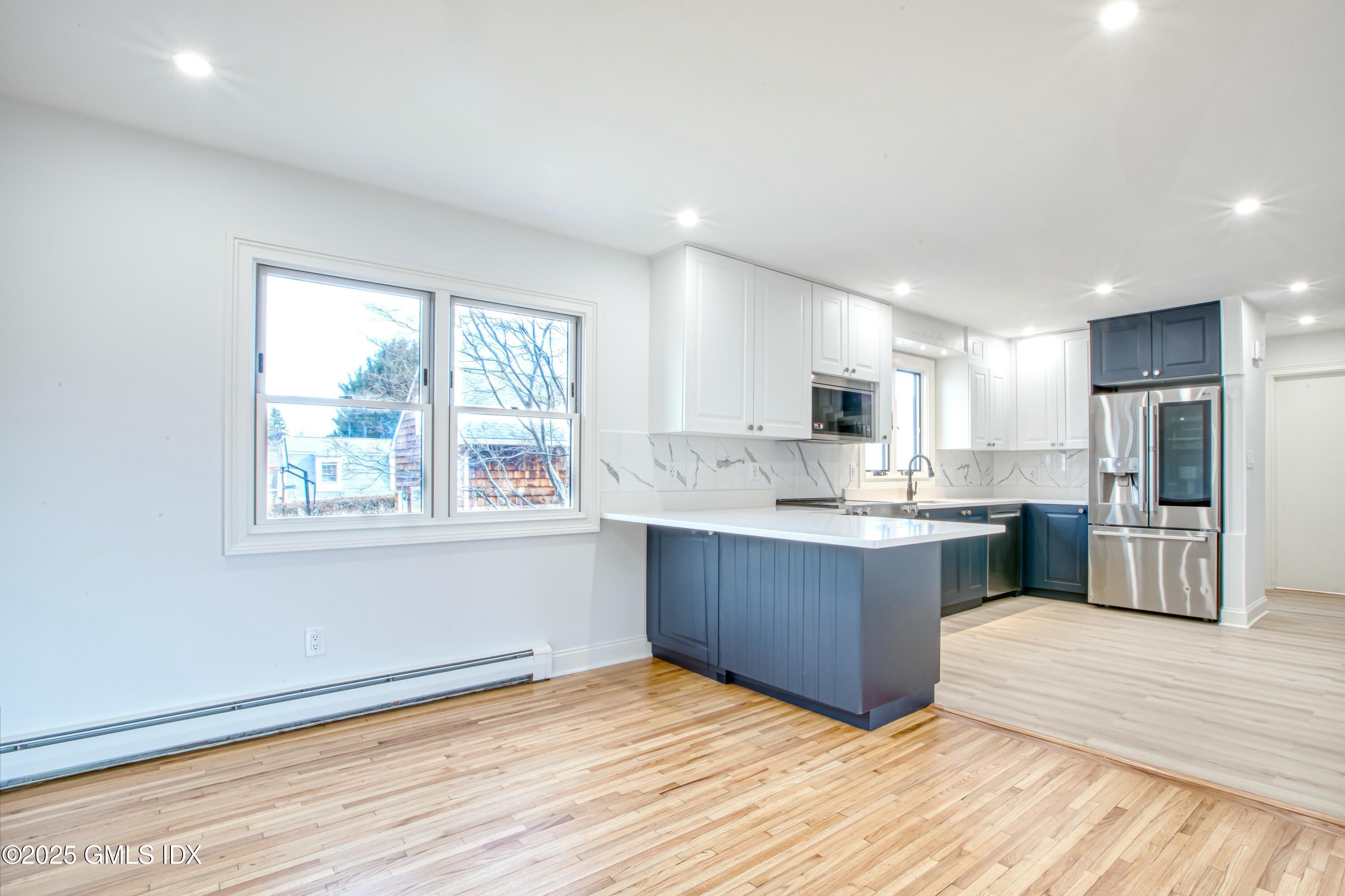 9 Apache Place Riverside, CT 06878 - Photo 6 of 23 a large kitchen with stainless steel appliances granite countertop a refrigerator and a stove top oven