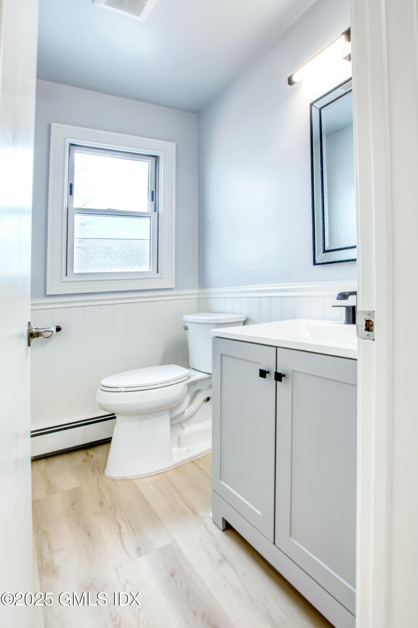 9 Apache Place Riverside, CT 06878 - Photo 10 of 23 a bathroom with a sink toilet vanity and mirror