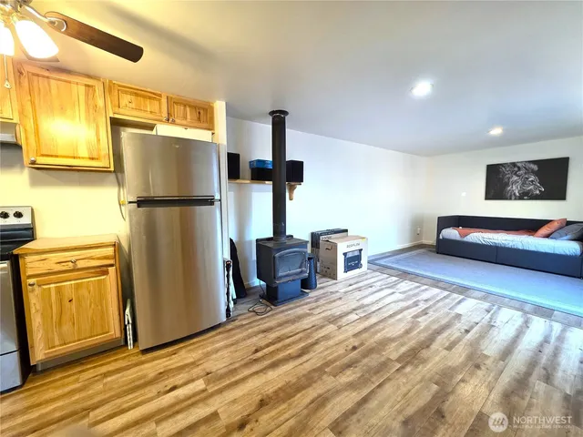 a bedroom with a bed a dresser and a mirror