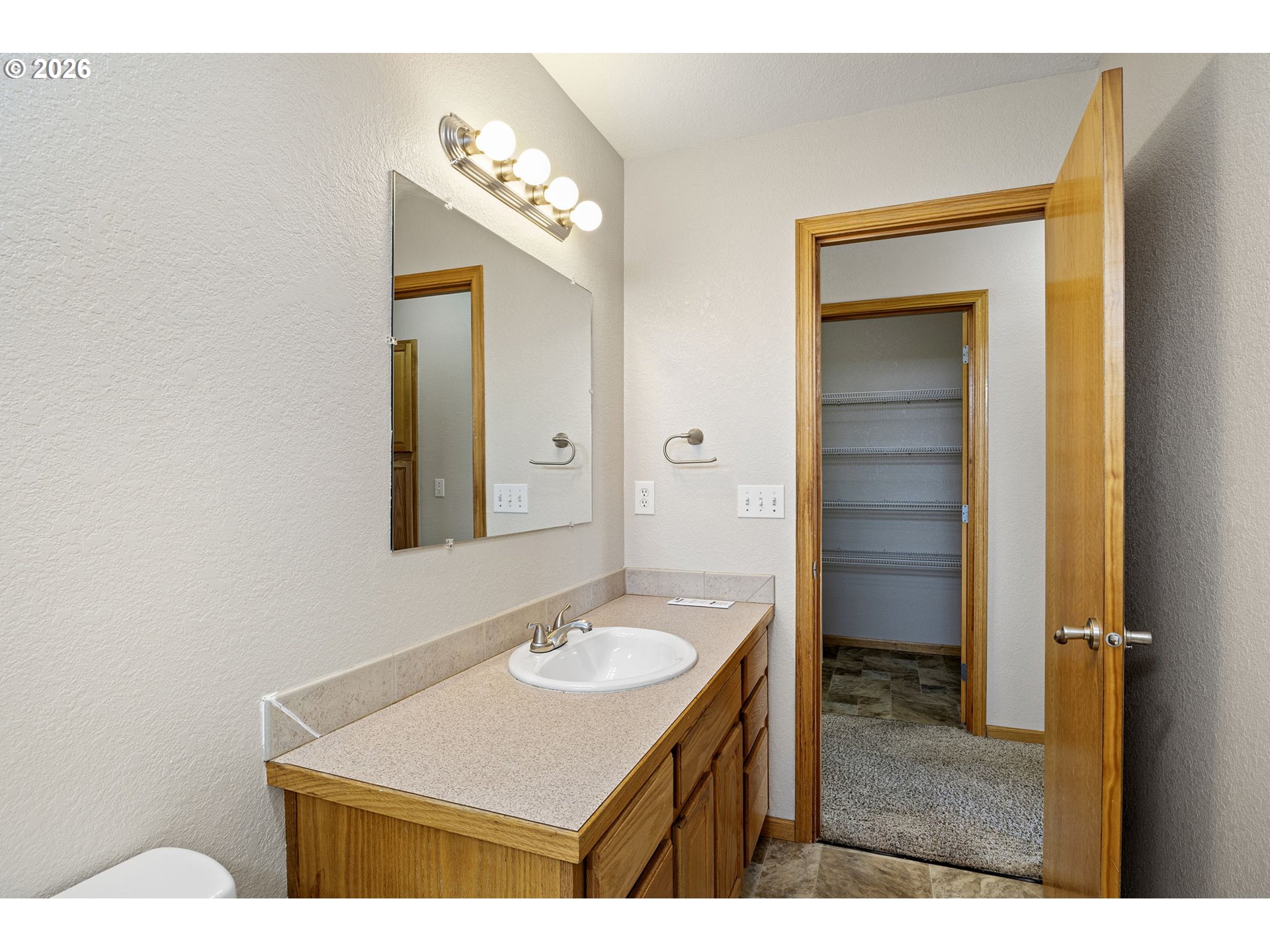 223 Armande Loop Roseburg, OR 97471 - Photo 22 of 35 a bathroom with a sink a vanity and a mirror