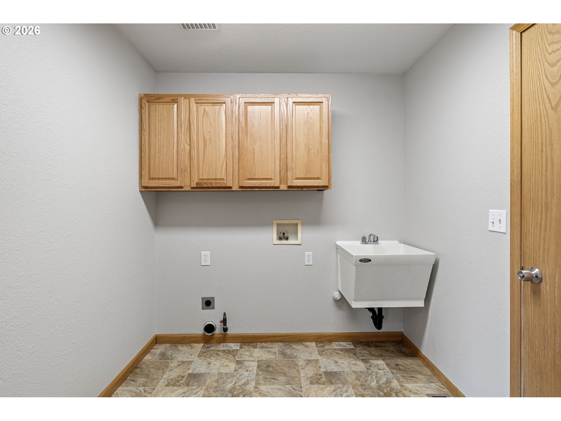 223 Armande Loop Roseburg, OR 97471 - Photo 28 of 35 a bathroom with a sink a toilet and a window