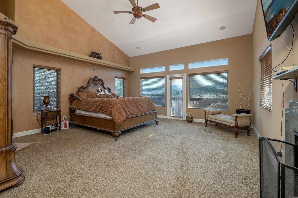 2016 South Grade Road Alpine, CA 91901 - Photo 11 of 27 a bed room with a bed and a large window