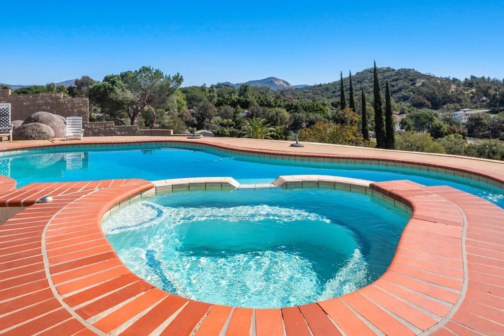 2016 South Grade Road Alpine, CA 91901 - Photo 3 of 27 a view of a swimming pool with a yard and mountain view