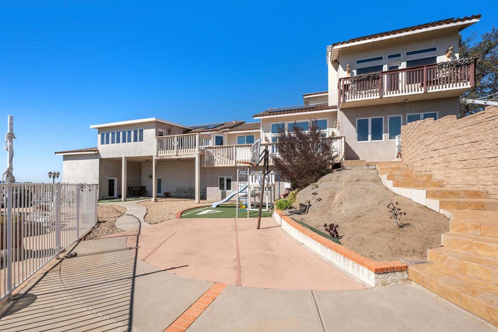 2016 South Grade Road Alpine, CA 91901 - Photo 5 of 27 a front view of a house with a yard