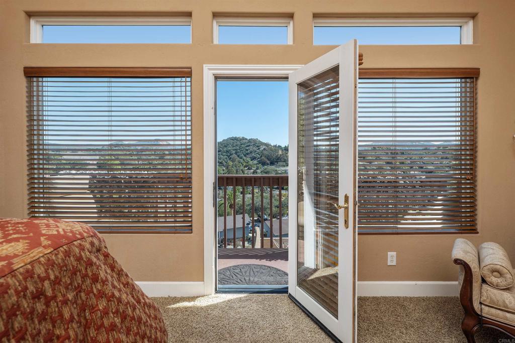2016 South Grade Road Alpine, CA 91901 - Photo 7 of 27 a view of a bedroom with a balcony and a balcony