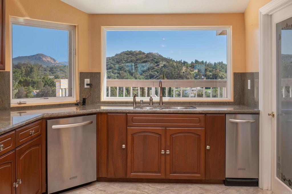 2016 South Grade Road Alpine, CA 91901 - Photo 9 of 27 a kitchen with a sink cabinets and a large window