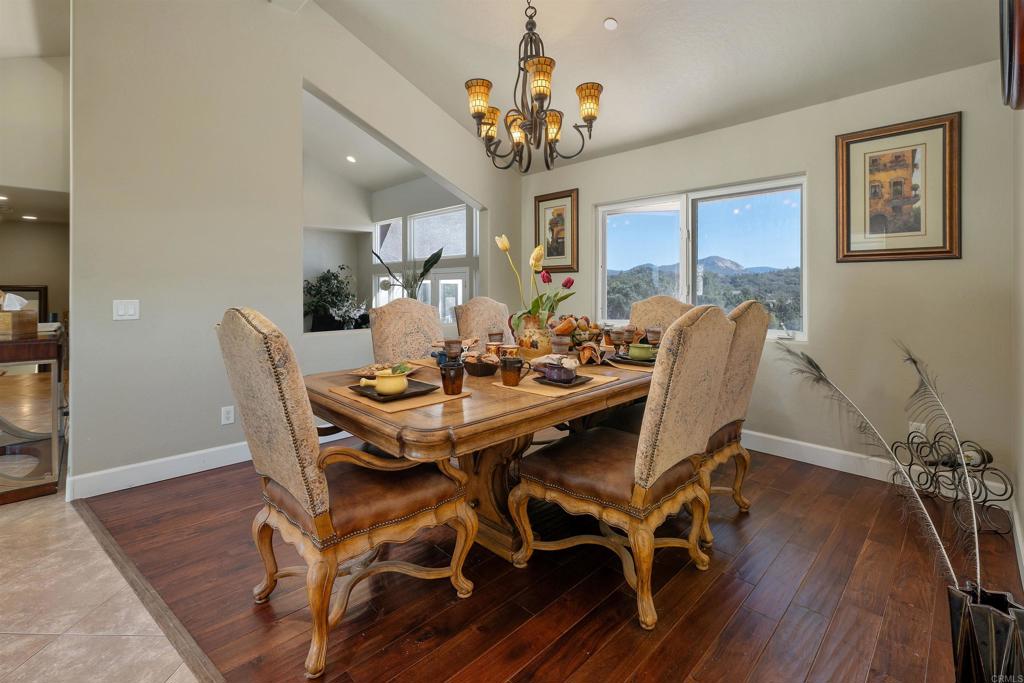 2016 South Grade Road Alpine, CA 91901 - Photo 10 of 27 a view of a dining room with furniture a chandelier and wooden floor