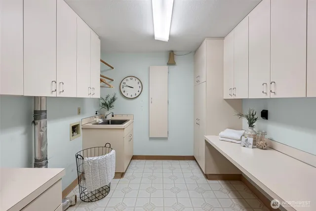 a kitchen with a sink and cabinets