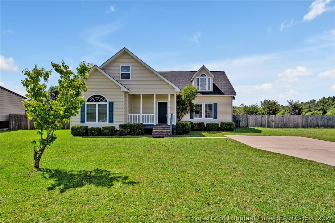 3713 Glenn Road Parkton, NC 28371 - Photo 1 of 17 a front view of a house with a yard