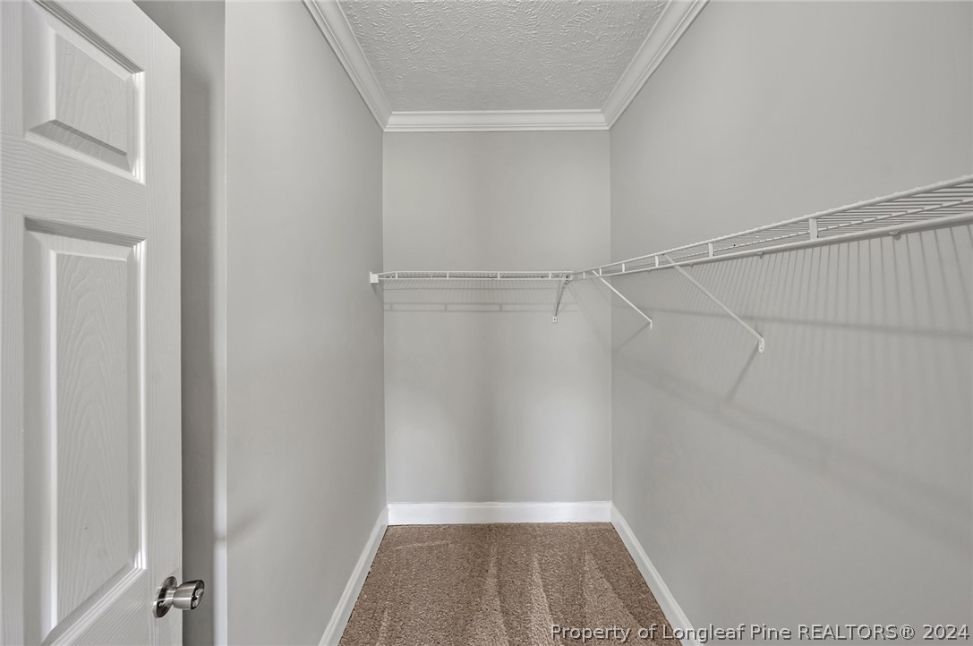3713 Glenn Road Parkton, NC 28371 - Photo 11 of 17 a view of a room with racks on the wall