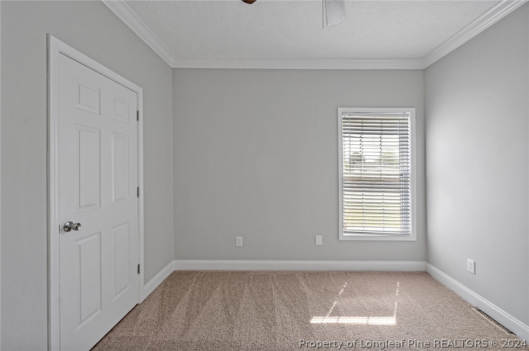 3713 Glenn Road Parkton, NC 28371 - Photo 14 of 17 a view of an empty room with a window