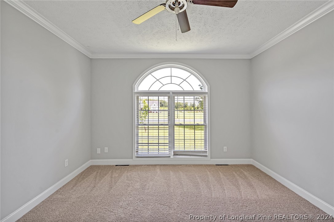 3713 Glenn Road Parkton, NC 28371 - Photo 8 of 17 an empty room with a window
