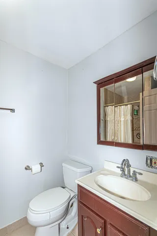 a kitchen with stainless steel appliances granite countertop a sink refrigerator and cabinets