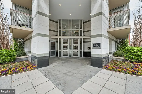 a view of a entryway with flower pots