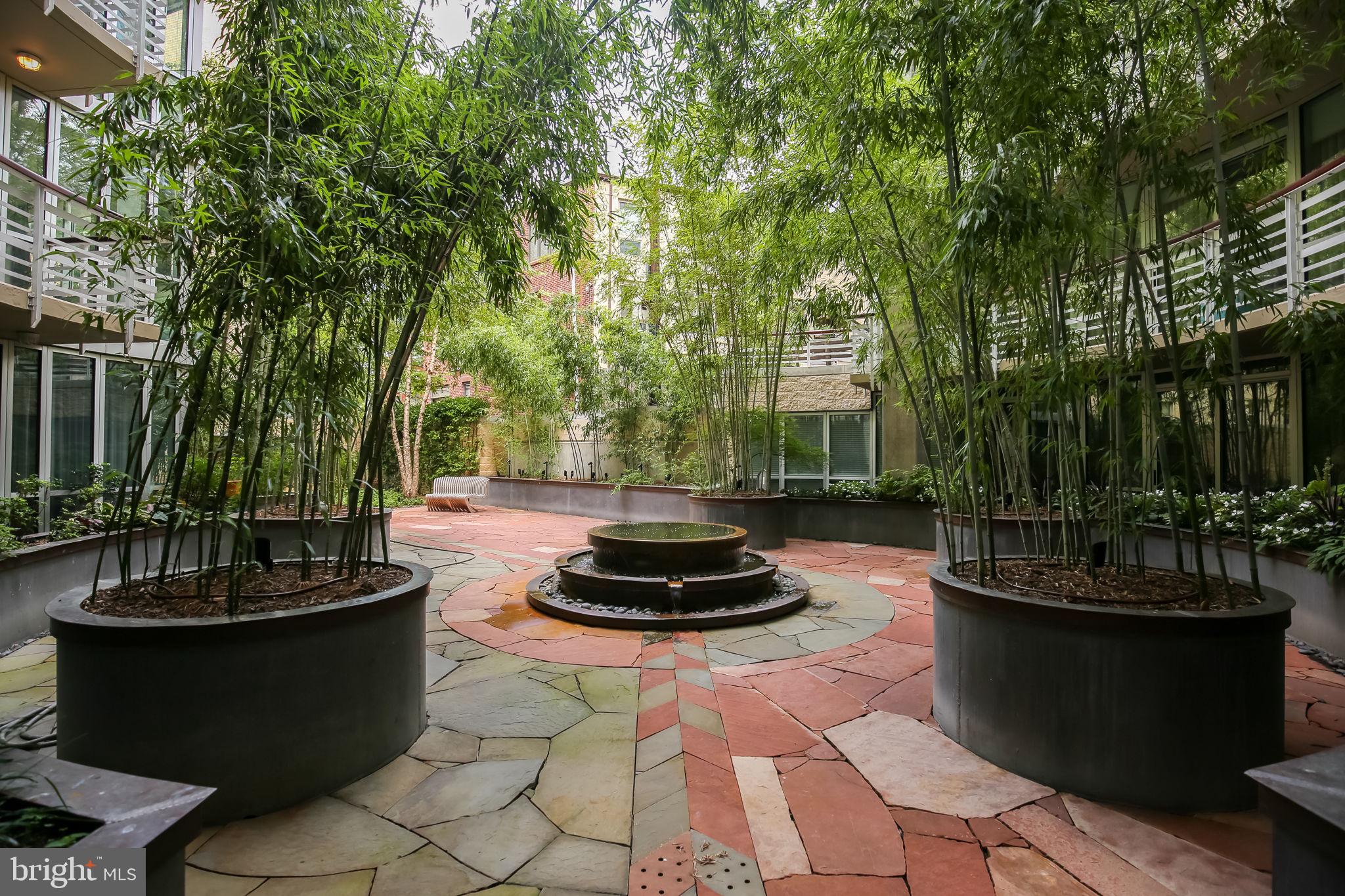 1300 13th Street Northwest, Unit 603 Washington, DC 20005 - Photo 20 of 26 a view of a patio with a dining table and chairs