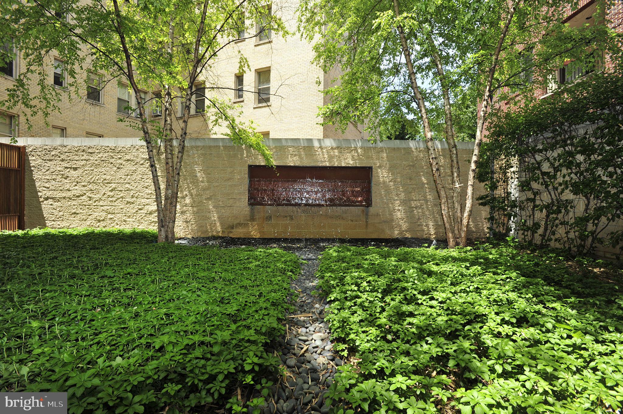1300 13th Street Northwest, Unit 603 Washington, DC 20005 - Photo 23 of 26 a sign that is sitting in front of a brick house