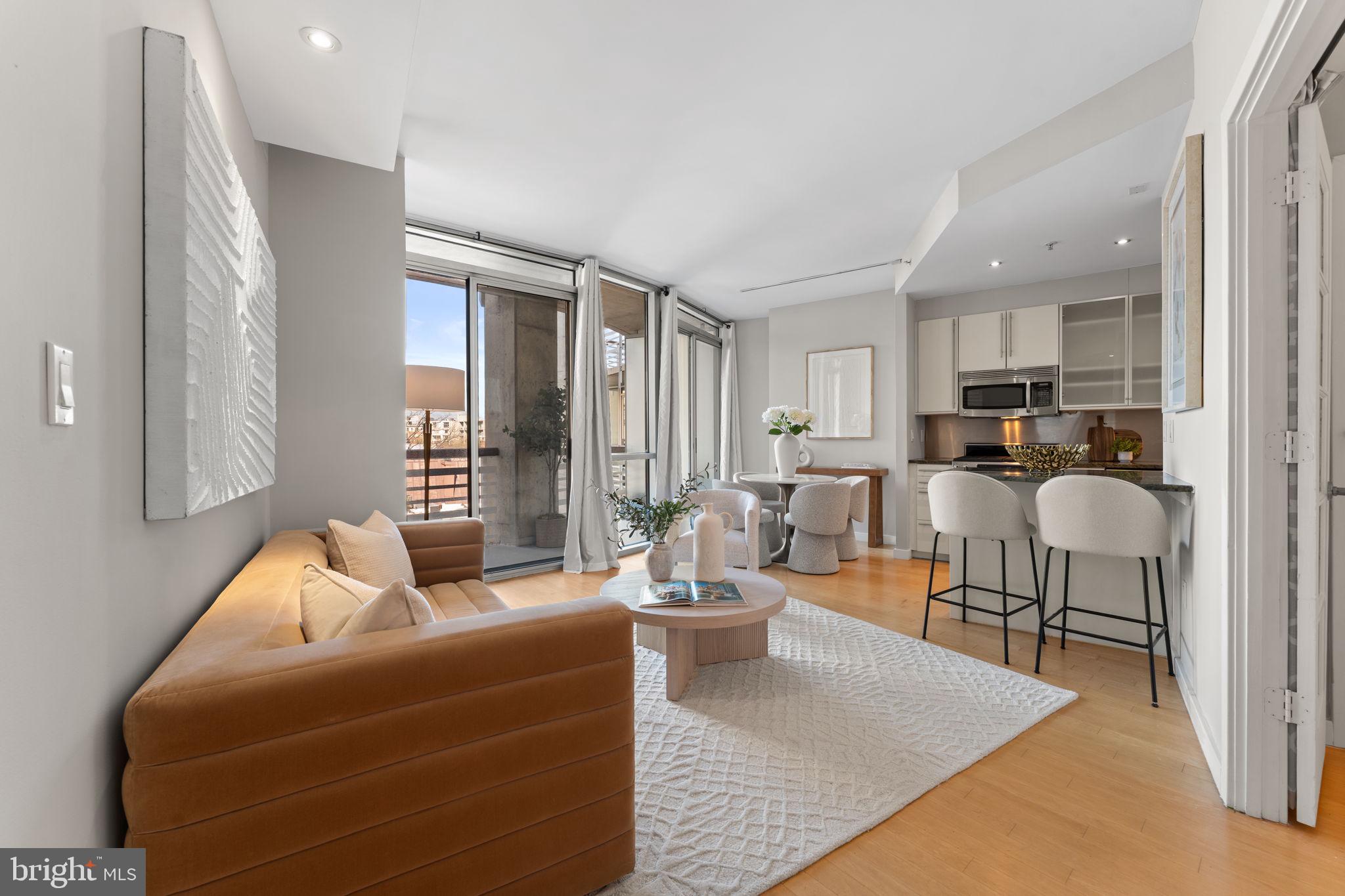 1300 13th Street Northwest, Unit 603 Washington, DC 20005 - Photo 4 of 26 a living room with furniture and a large window