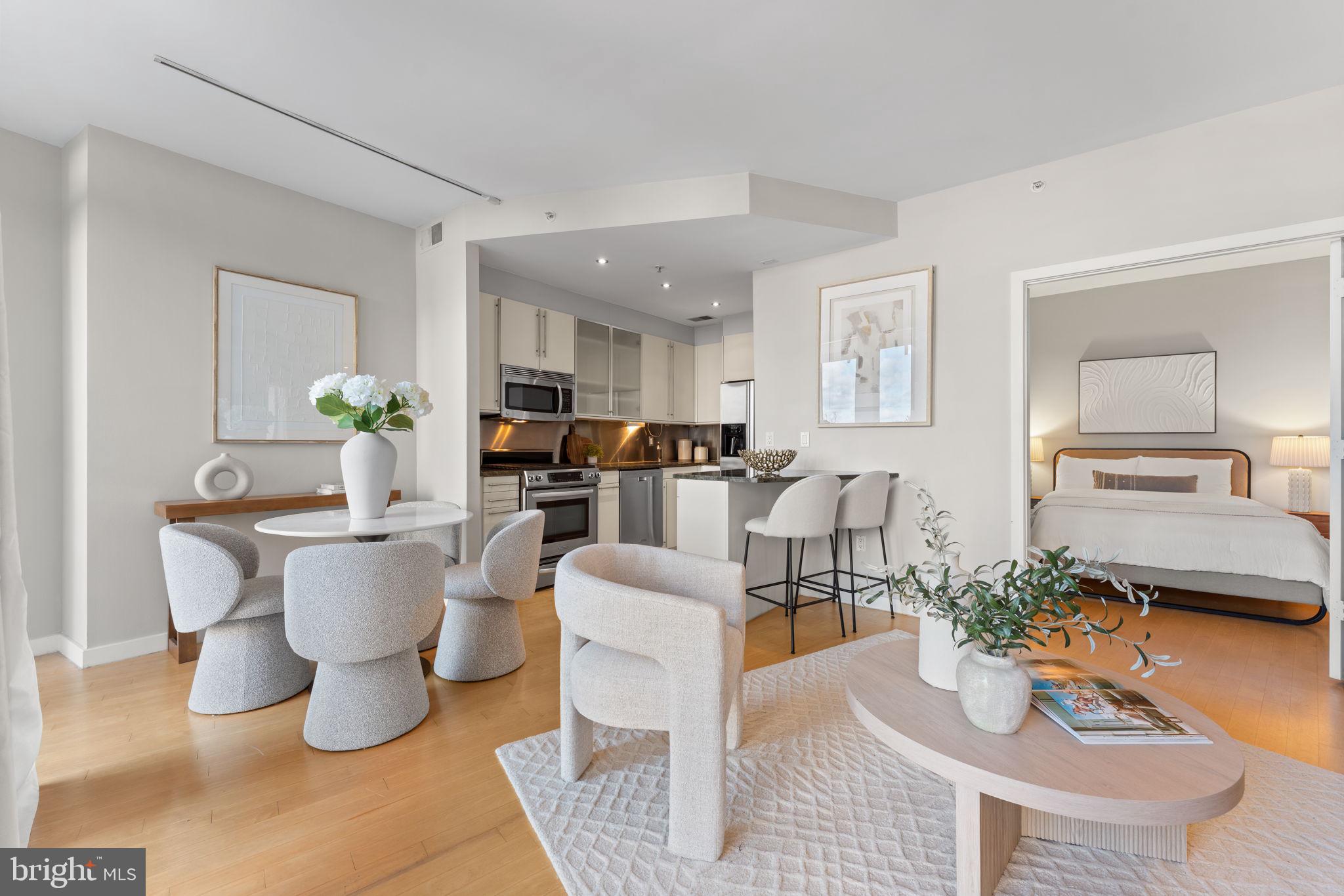 1300 13th Street Northwest, Unit 603 Washington, DC 20005 - Photo 6 of 26 a living room with furniture and a dining table