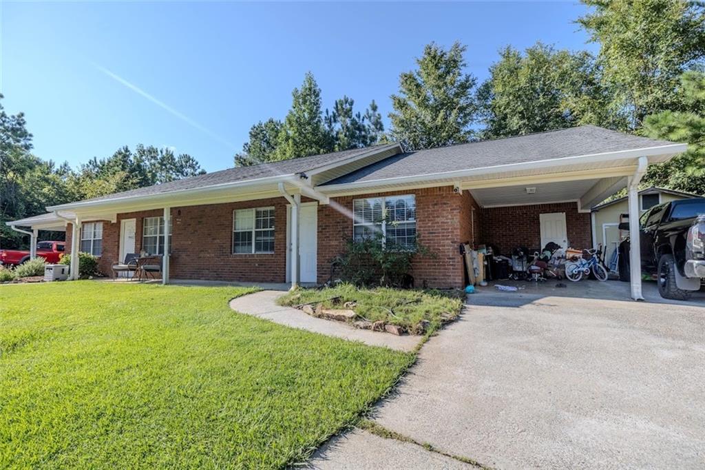 15 Oakcrest Trail Northeast Rome, GA 30165 - Photo 12 of 22 a view of a house with table and chairs in patio