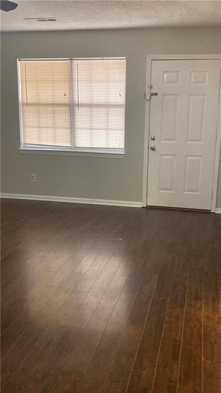 15 Oakcrest Trail Northeast Rome, GA 30165 - Photo 18 of 22 an empty room with wooden floor and windows