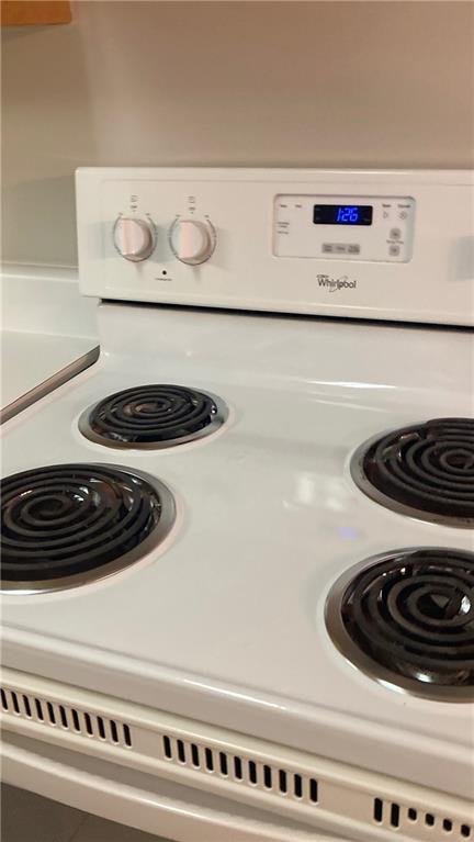 15 Oakcrest Trail Northeast Rome, GA 30165 - Photo 19 of 22 a close view of a stove and a washer with washing machine