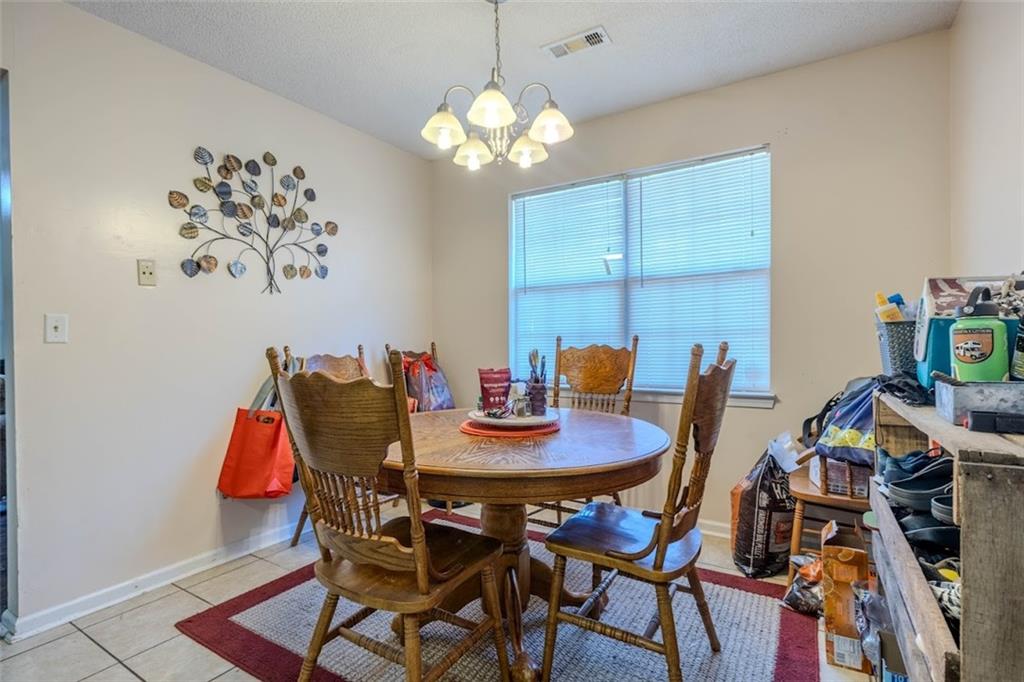 15 Oakcrest Trail Northeast Rome, GA 30165 - Photo 5 of 22 a view of a dining room with furniture and chandelier