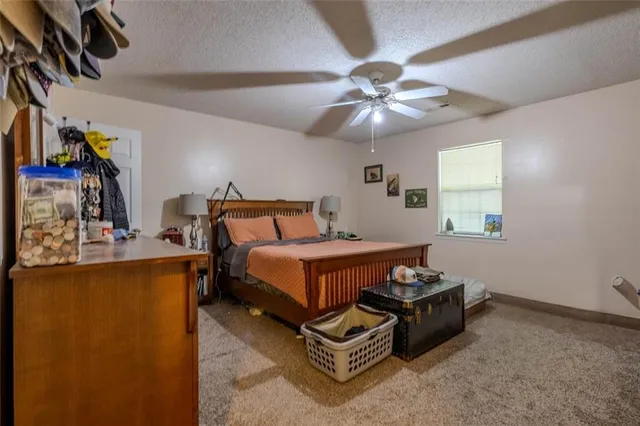 a bedroom with bed and window