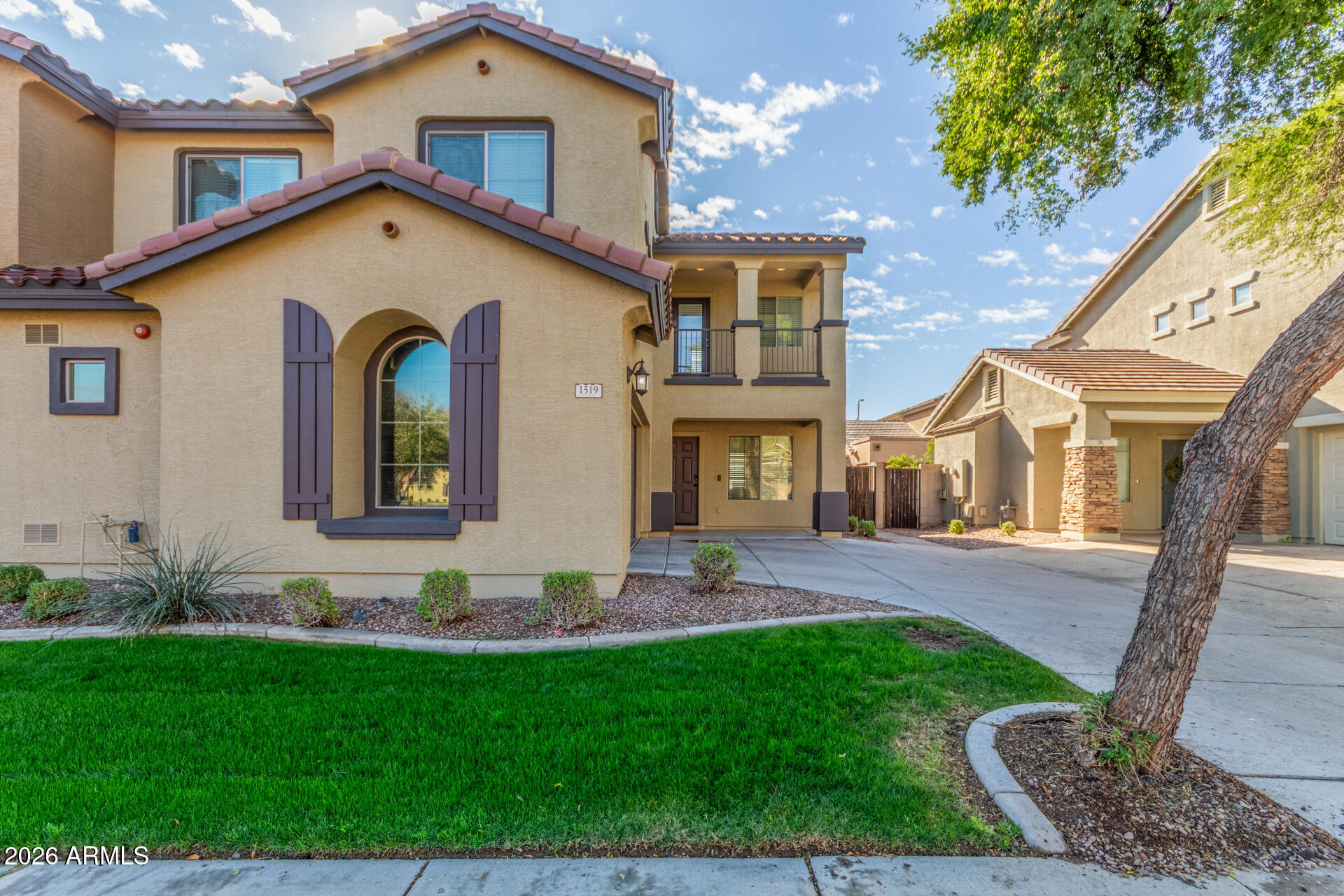 1519 East Elgin Street Gilbert, AZ 85295 - Photo 1 of 36 a front view of a house with garden