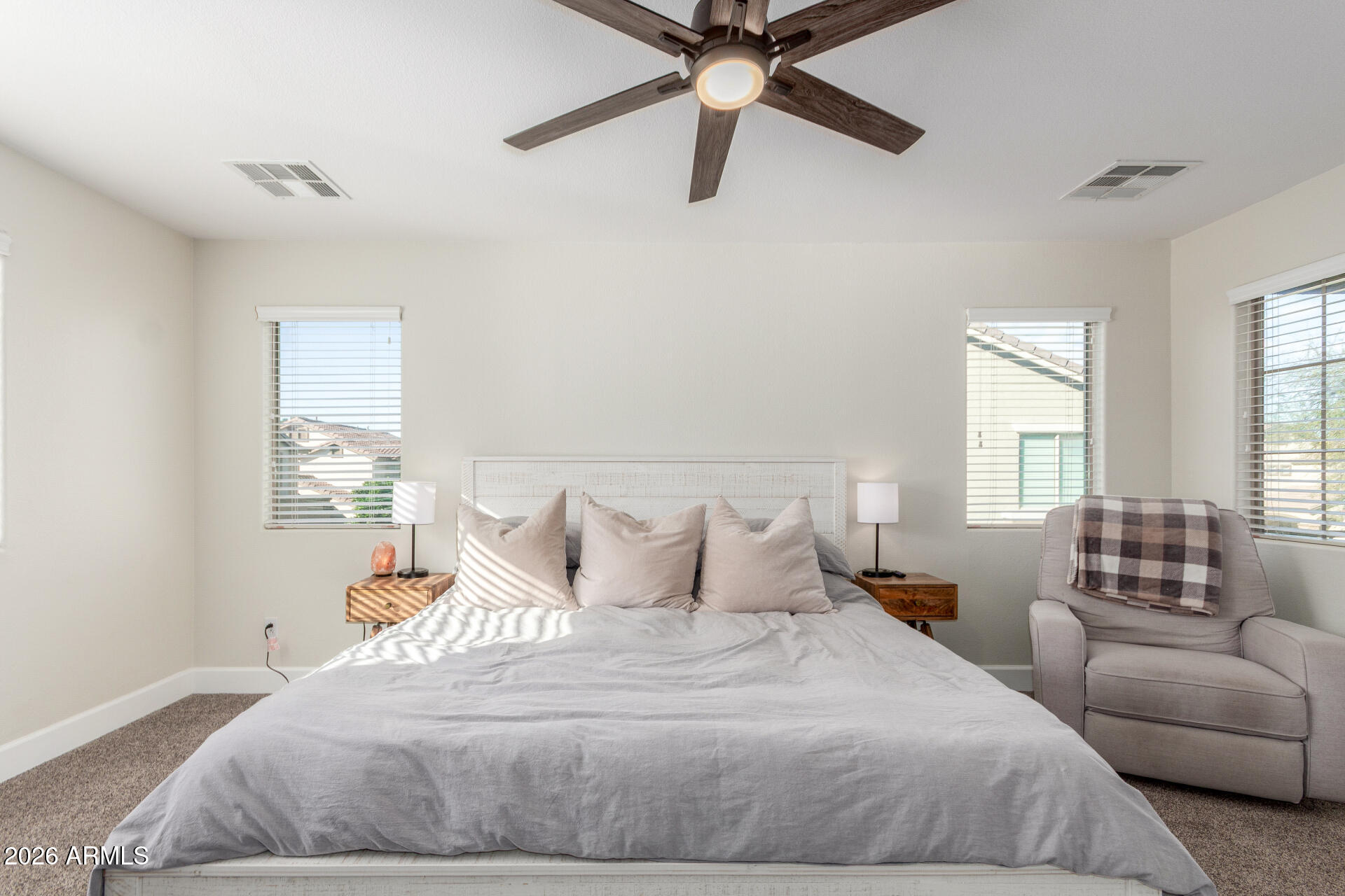 1519 East Elgin Street Gilbert, AZ 85295 - Photo 15 of 36 a bedroom with a bed and a couch