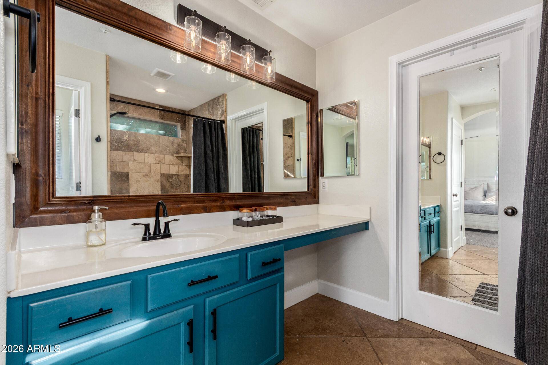 1519 East Elgin Street Gilbert, AZ 85295 - Photo 18 of 36 a bathroom with a double vanity sink and mirror