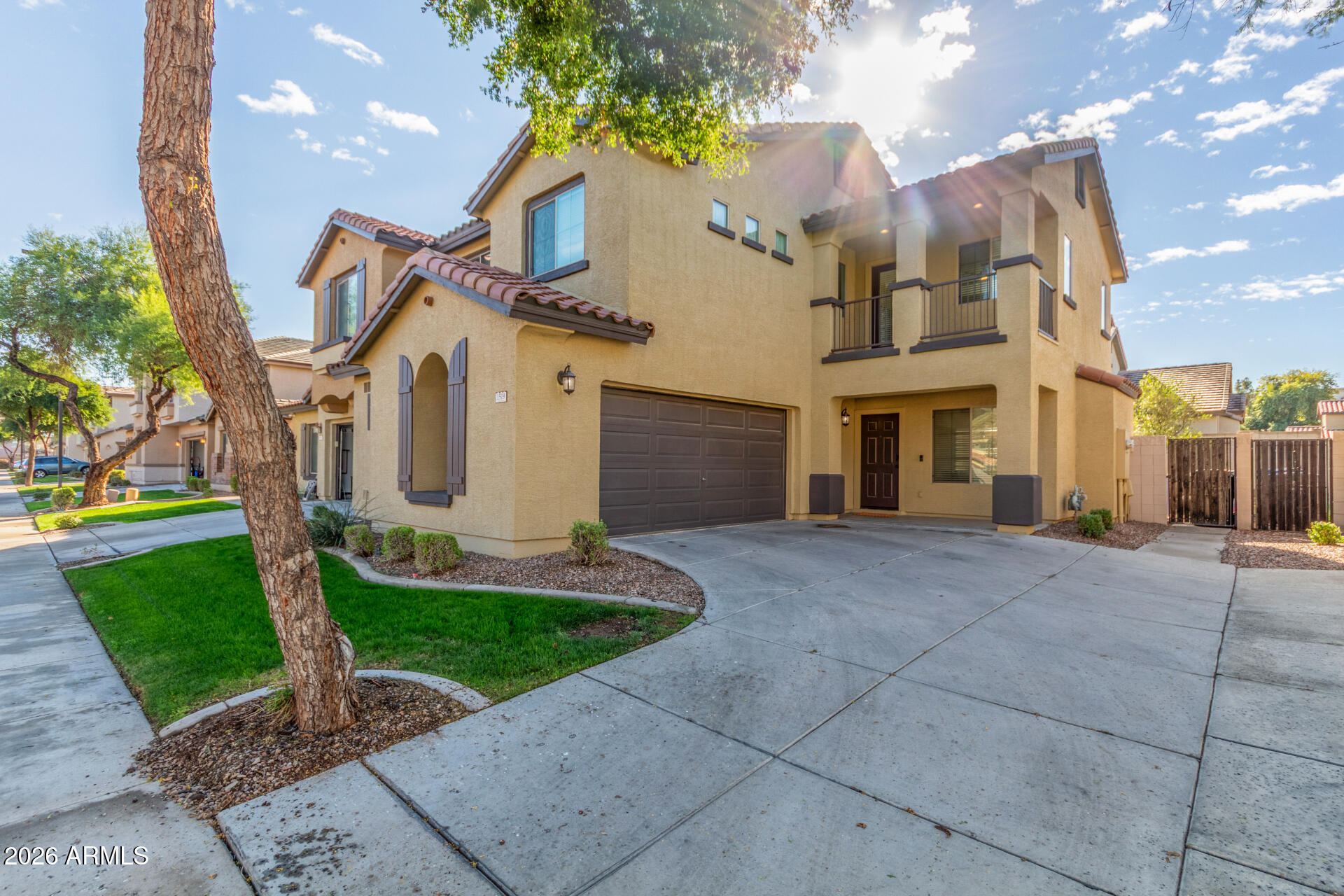 1519 East Elgin Street Gilbert, AZ 85295 - Photo 2 of 36 a front view of a house with a yard and garage
