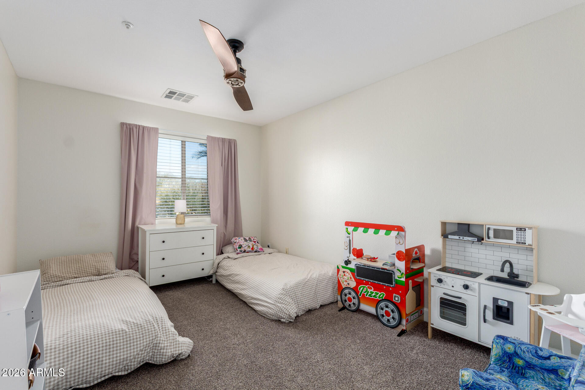 1519 East Elgin Street Gilbert, AZ 85295 - Photo 23 of 36 a bedroom with furniture and a large window