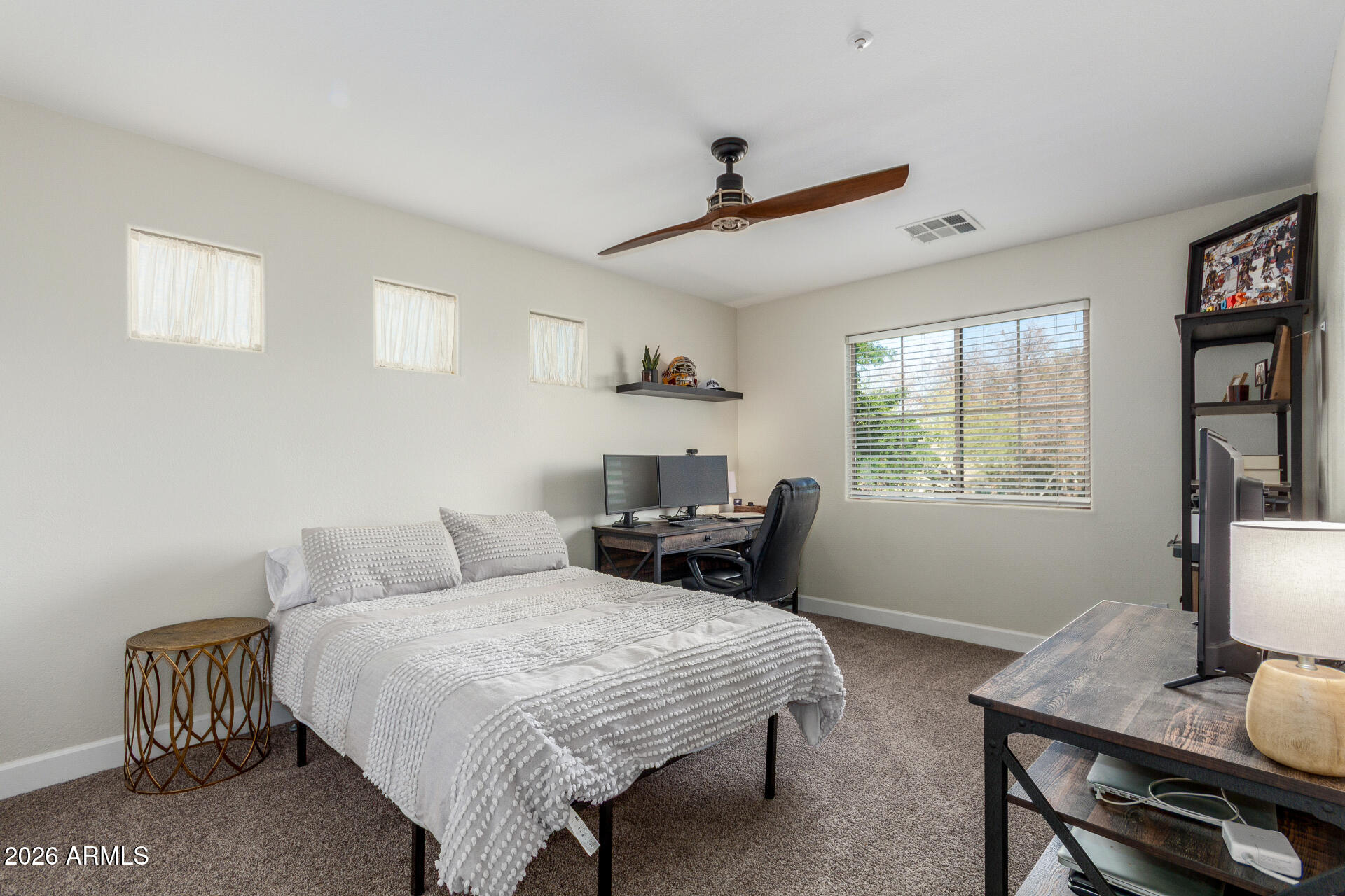 1519 East Elgin Street Gilbert, AZ 85295 - Photo 24 of 36 a bedroom with a bed and a window