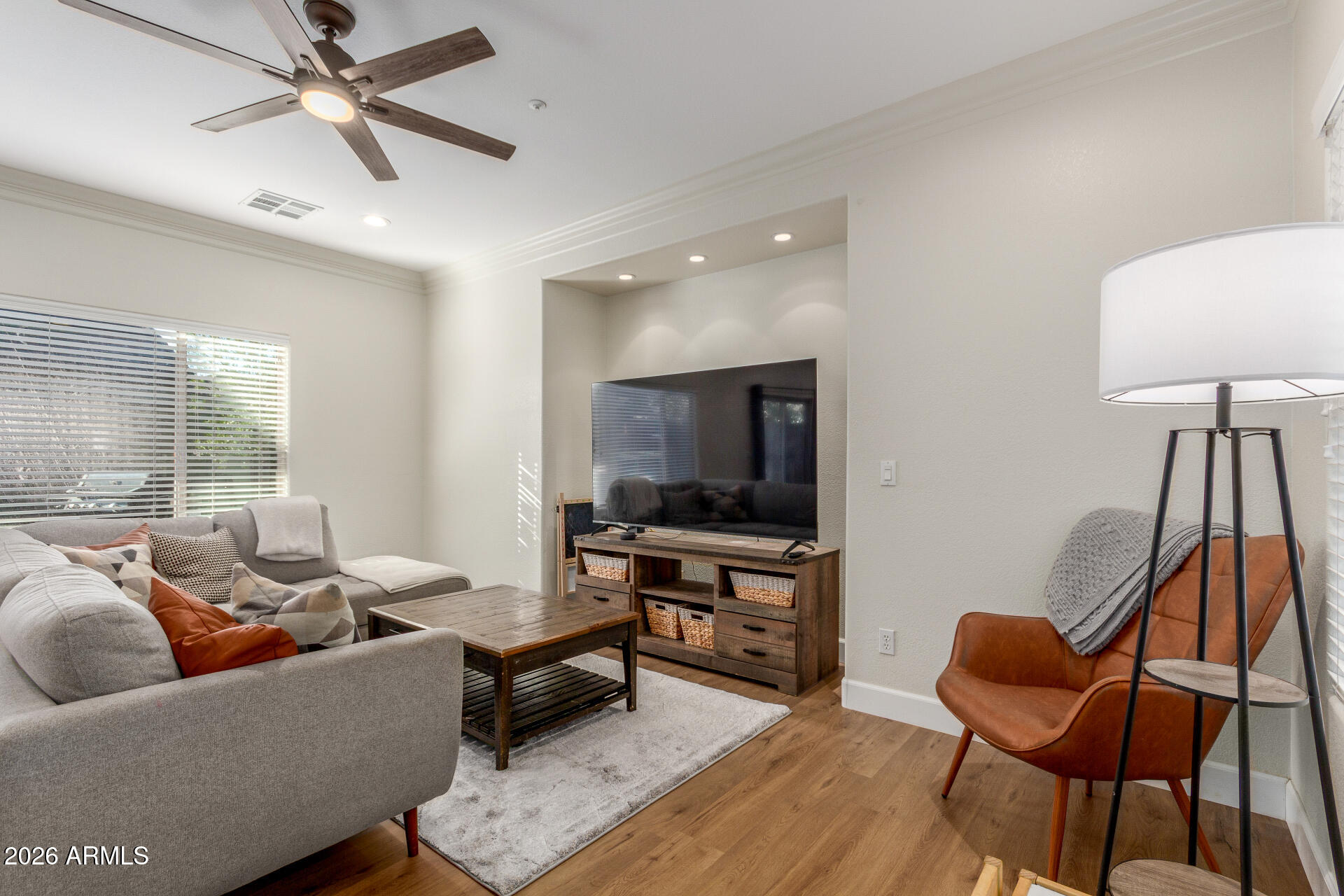 1519 East Elgin Street Gilbert, AZ 85295 - Photo 4 of 36 a living room with furniture and a flat screen tv