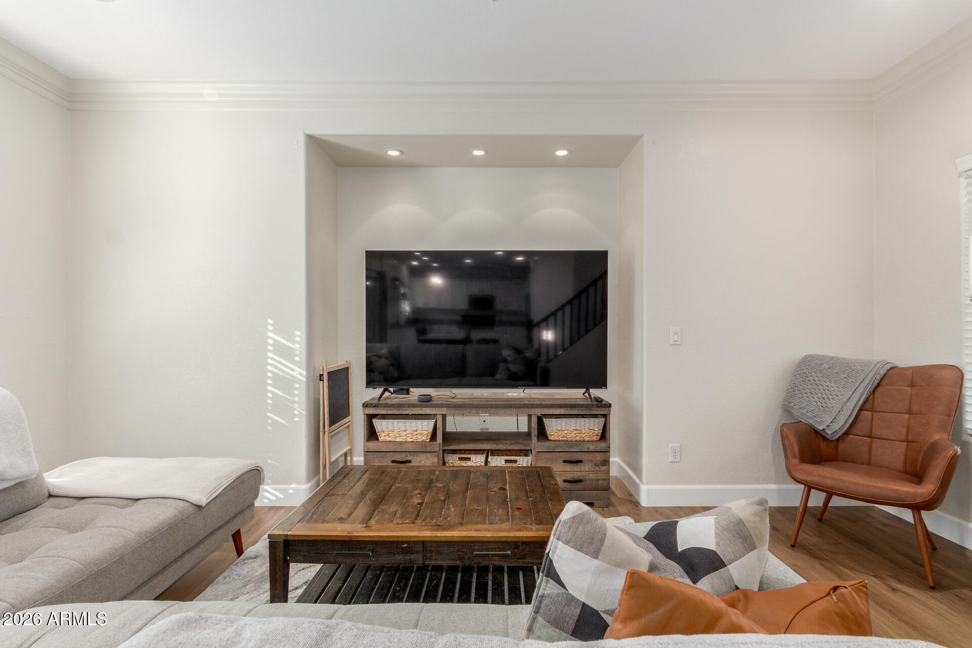 1519 East Elgin Street Gilbert, AZ 85295 - Photo 5 of 36 a living room with furniture and a flat screen tv