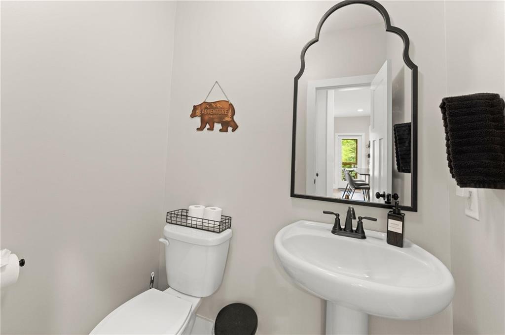 1320 Preacher Campbell Road Clarkesville, GA 30523 - Photo 10 of 36 a bathroom with a toilet sink and mirror