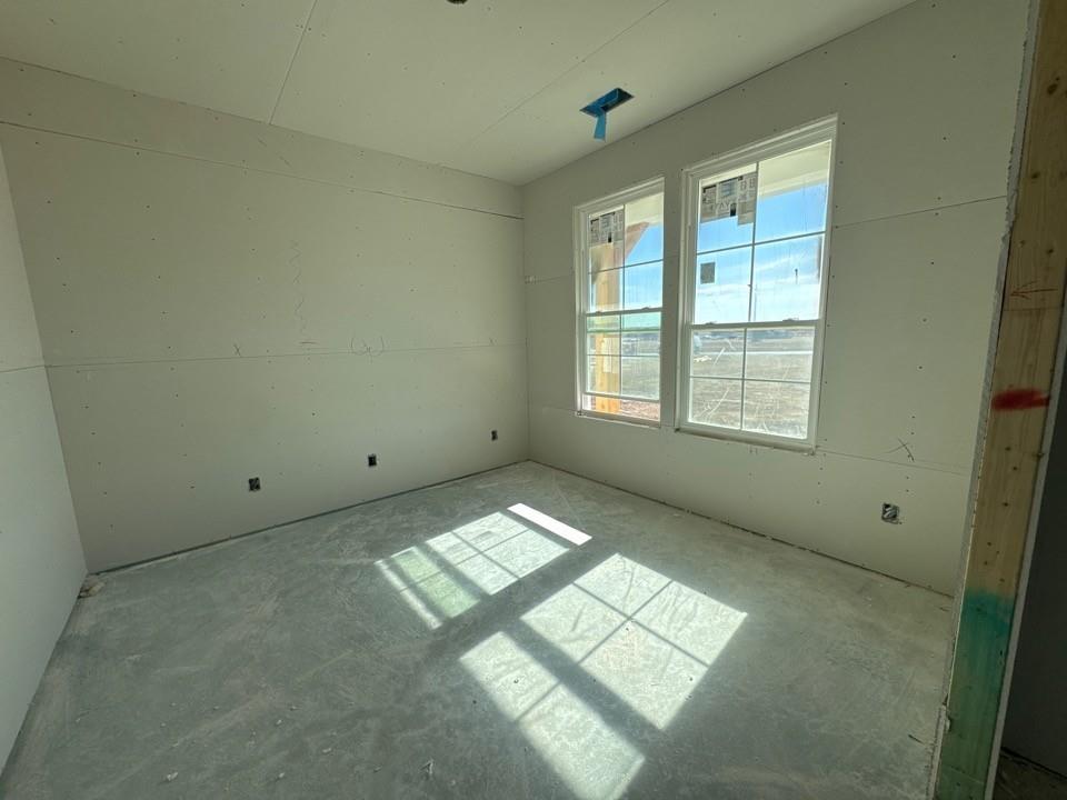 154 Snowy Owl Trail Rhome, TX 76078 - Photo 13 of 13 an empty room with windows
