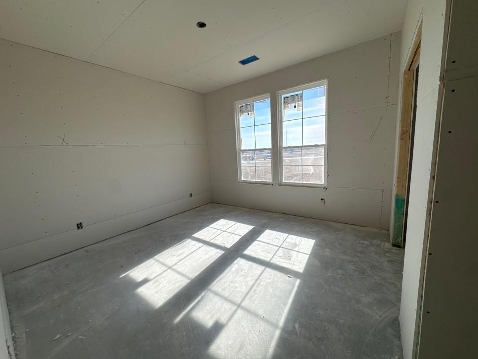154 Snowy Owl Trail Rhome, TX 76078 - Photo 5 of 13 a view of wooden floor and windows in a room