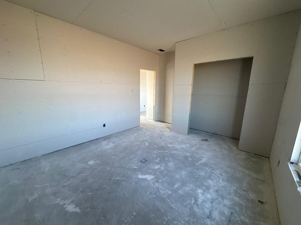 154 Snowy Owl Trail Rhome, TX 76078 - Photo 7 of 13 an empty room with windows