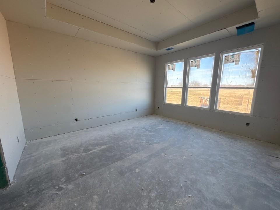 154 Snowy Owl Trail Rhome, TX 76078 - Photo 10 of 13 a view of an empty room with a window