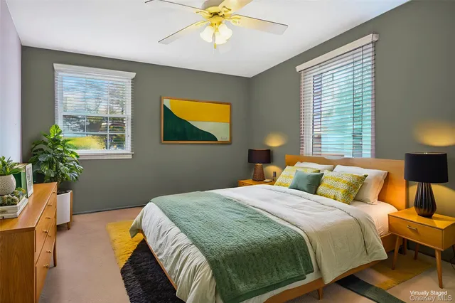 a bathroom with a sink mirror and shower
